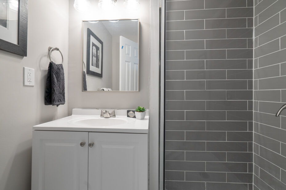 Modern bathroom featuring a shower stall and sink, renovated by Veteran Built Homes in Washington, D.C.
