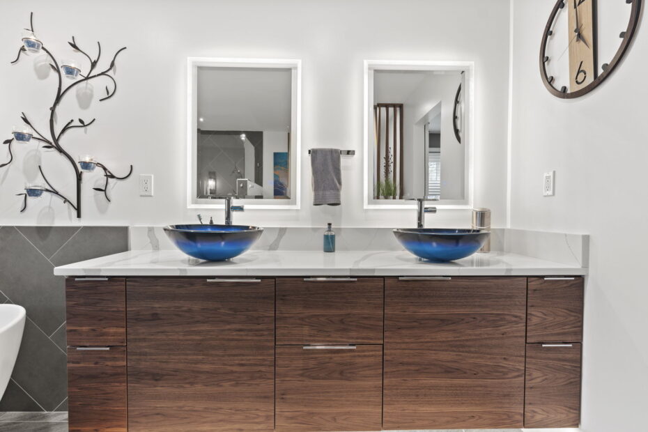Contemporary bathroom renovation completed by Veteran Built Homes in Woodbridge Virginia showcasing a double sink and a striking blue bowl on the vanity.