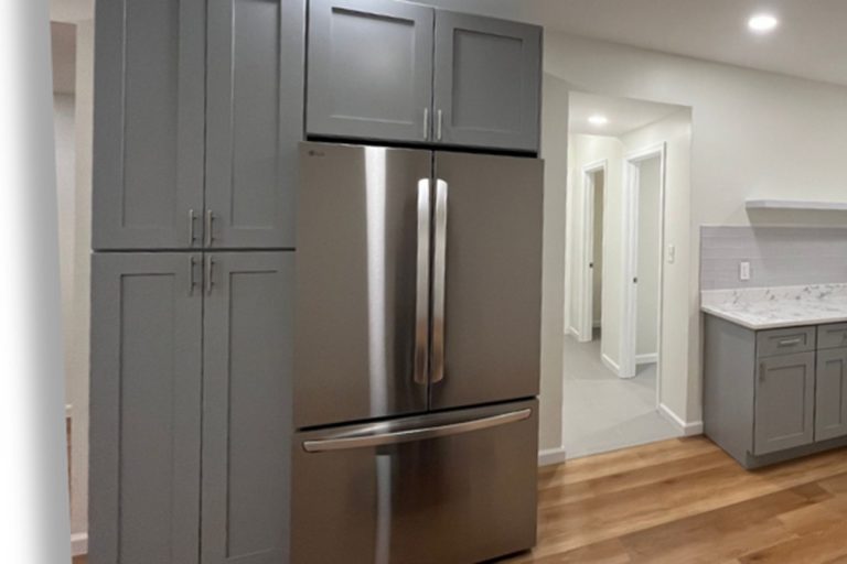 Basement kitchen in grey tones remodeled by Veteran Built Homes in Woodbridge, Virginia